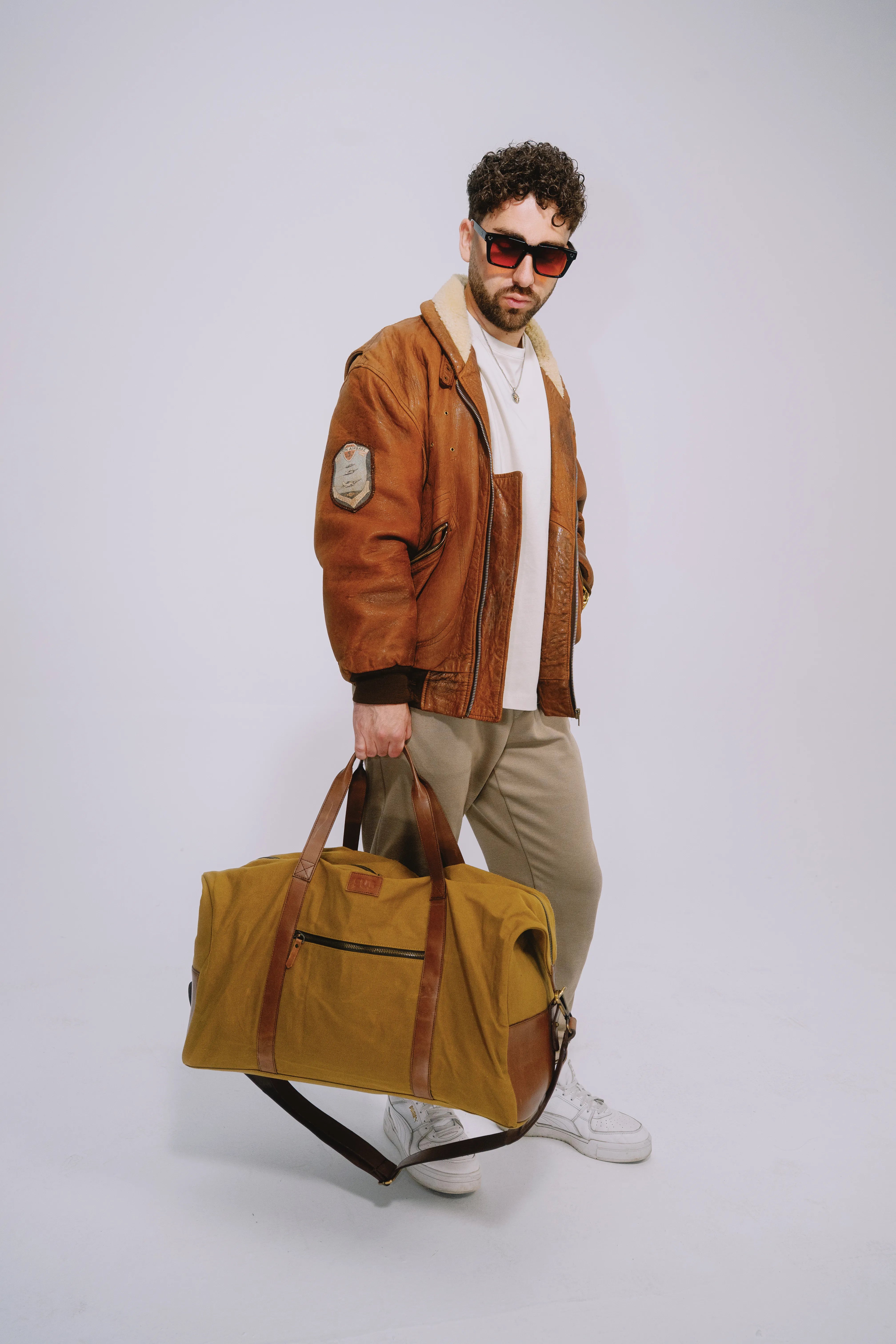 Ochre travel bag designed for airports, road trips and daily journeys