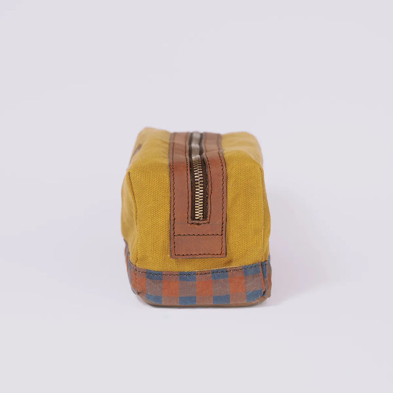 Side of a Golden Ochre travel pouch The Soil Travellers Kit on white background