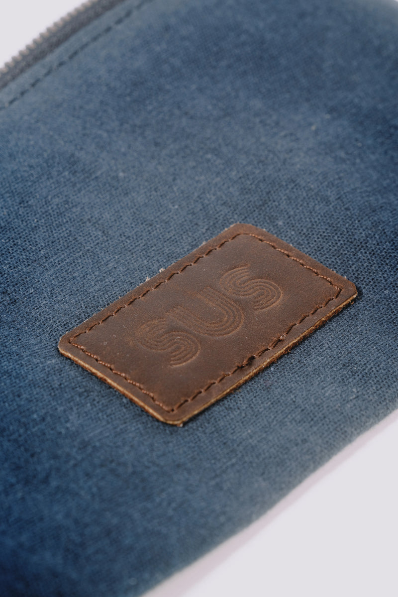 Close-up of a leather logo on a pouch