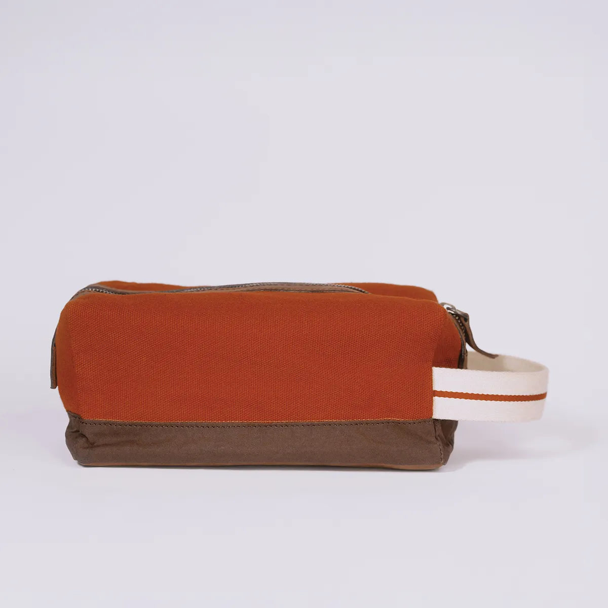 Back of a rusty red toiletry bag